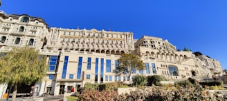 Elegant navy blue accented building with landscaped front yard