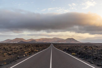 a long straight road in the middle of nowhere