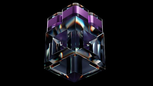A 3D geometric sculpture with a glossy, reflective surface is centered against a black background. The structure features complex shapes with sharp edges and consists of transparent and purple-tinted sections.