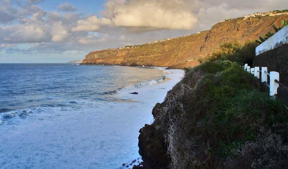 a view of the ocean from a cliff