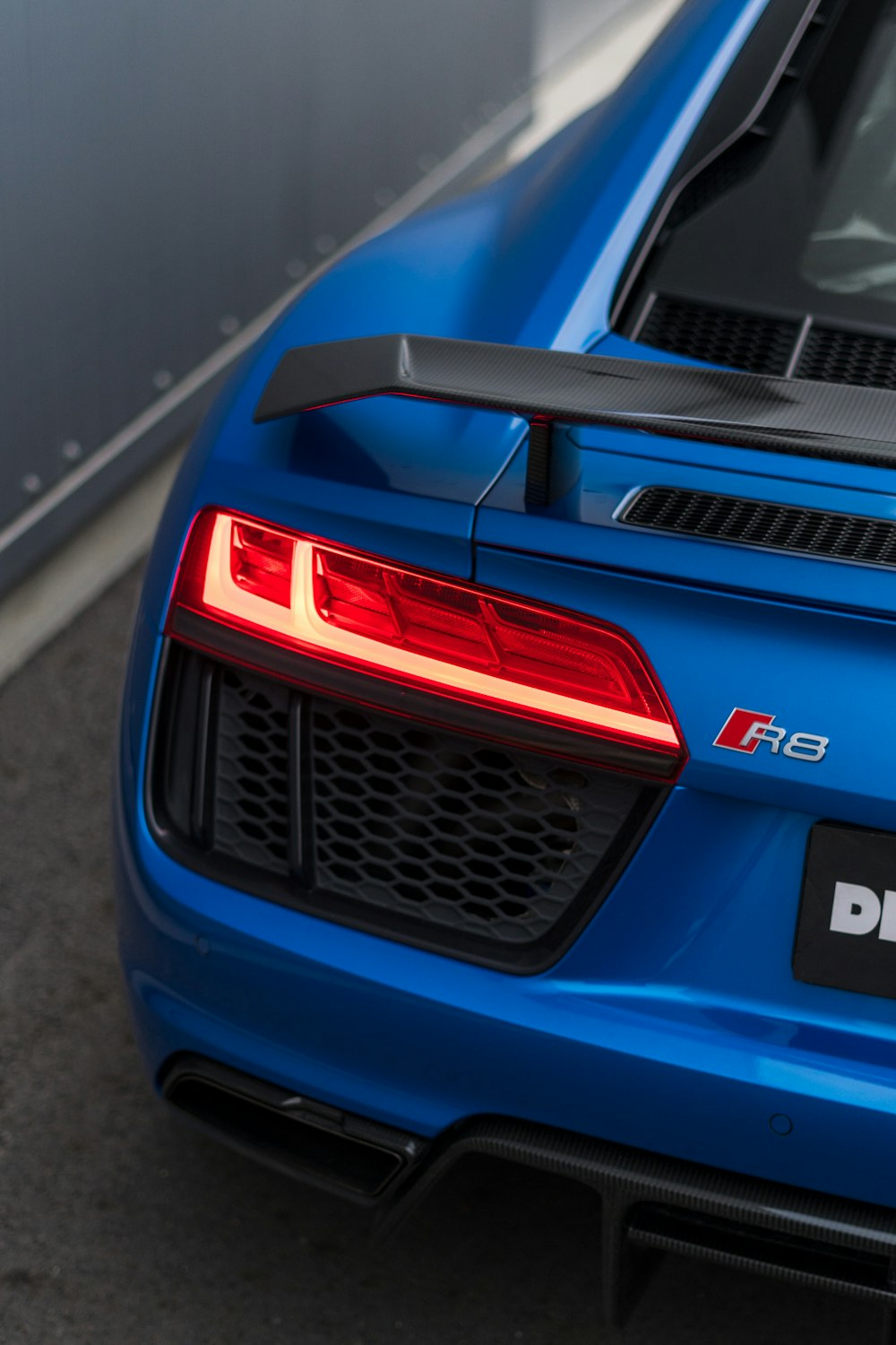 the back end of a blue sports car