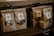 Paper bags with transparent windows are arranged on a wooden shelf, each labeled with product names such as Madeleine and Chestnuts, accompanied by price tags in both English and Chinese.