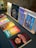 A collection of various ebooks displayed on a wooden table.