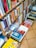 A close-up of a well-organized bookshelf filled with colorful book covers.