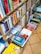 A close-up of a well-organized bookshelf filled with colorful book covers.