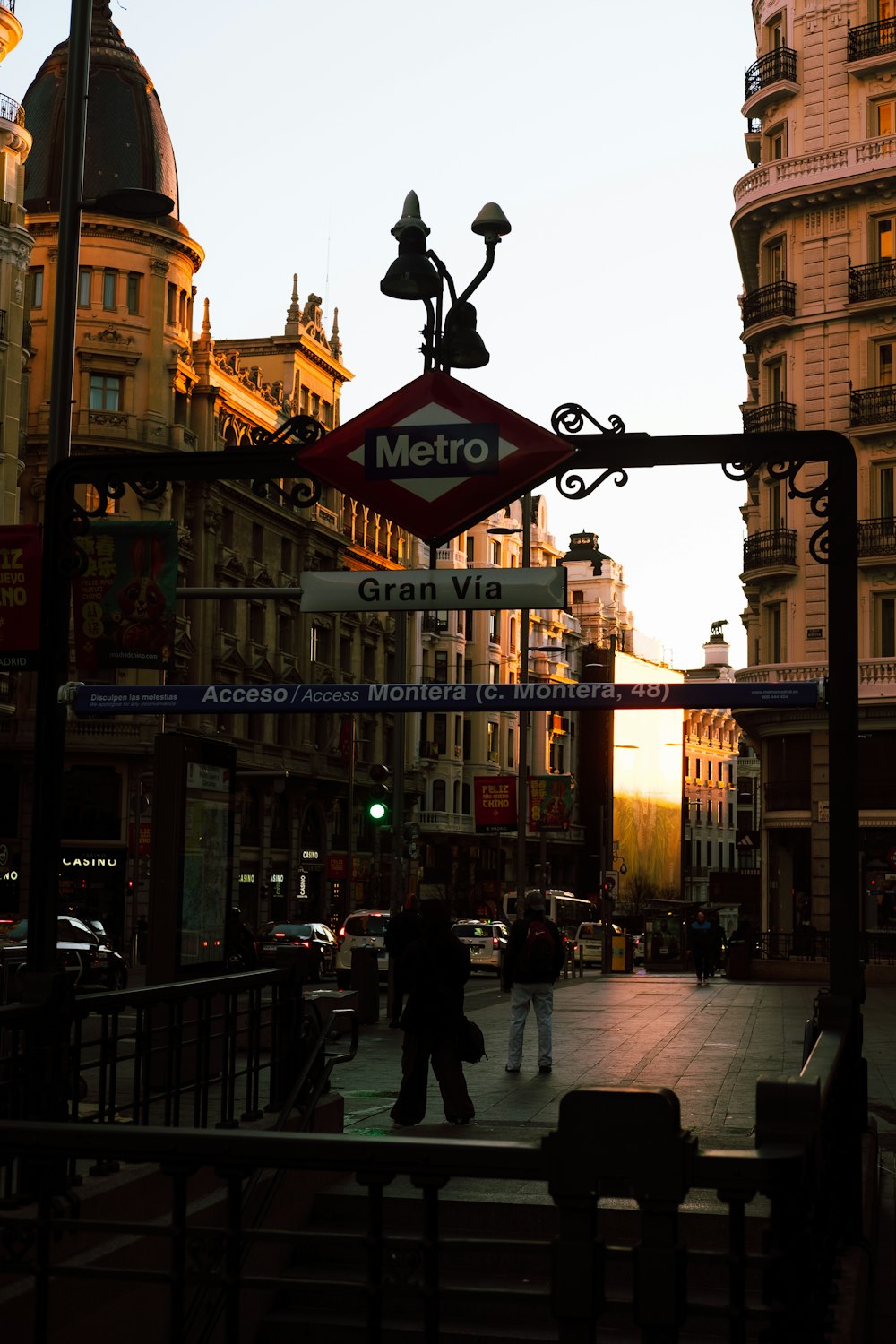 a street sign on a city street with buildings in the background