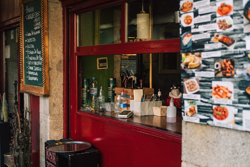 a restaurant with menus on the outside of it