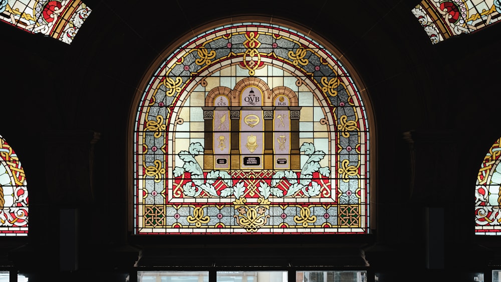 a large stained glass window in a building