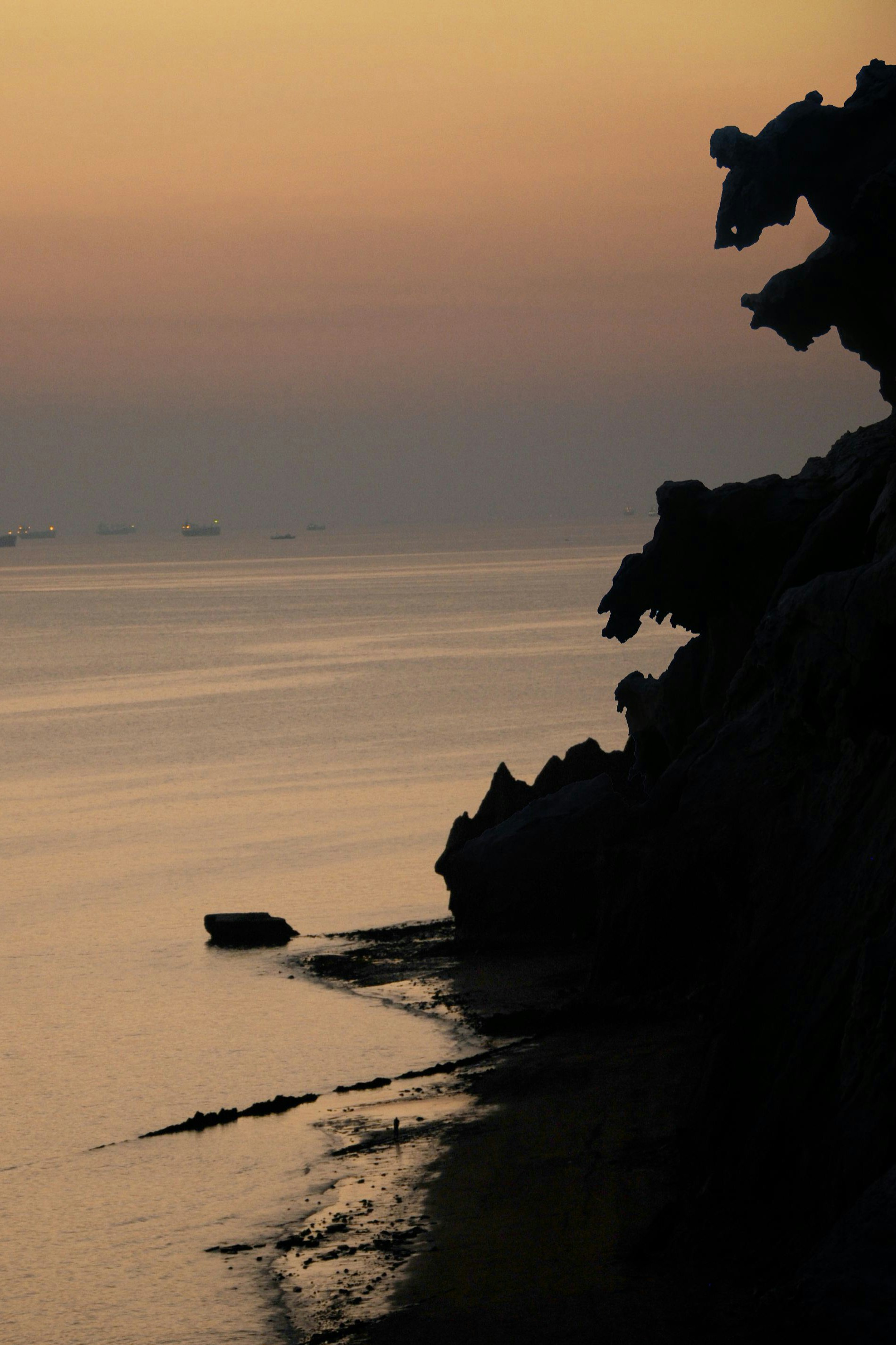 a body of water with a boat in the distance