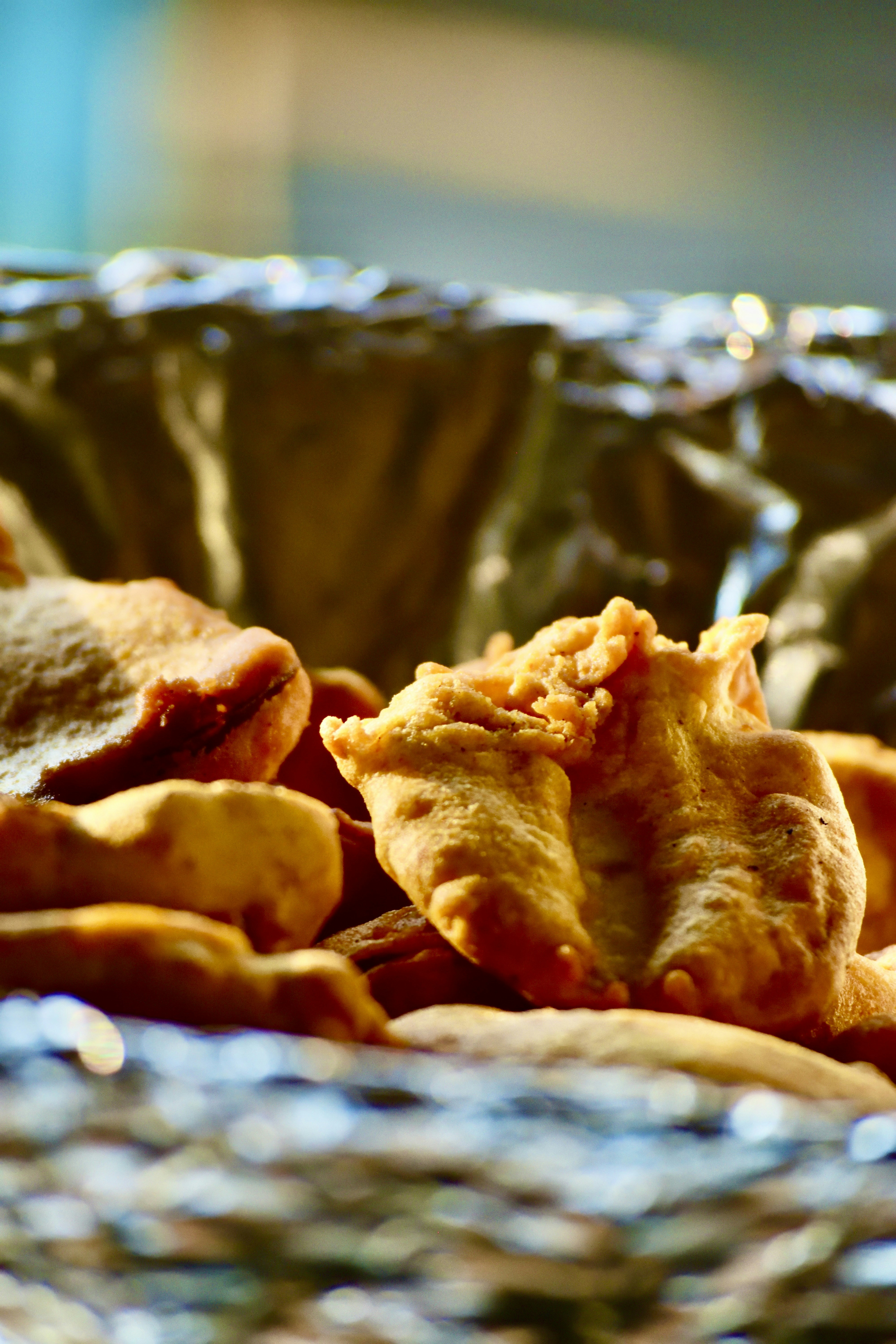 Fried chicken feast spread dark atmospheric moody low light steam rising golden crispy