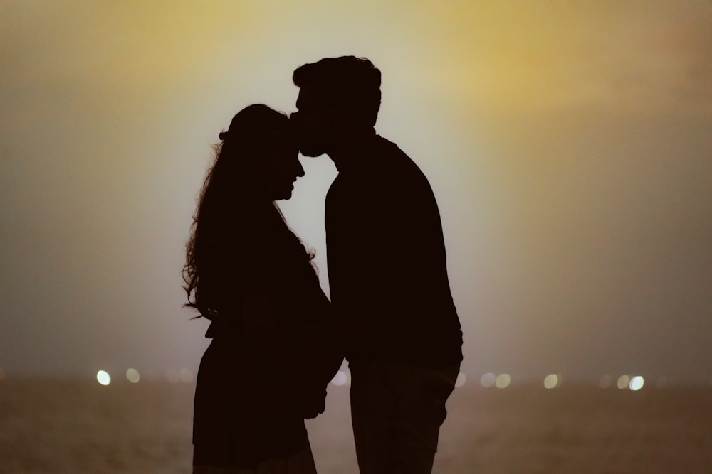 a man and a woman standing next to each other