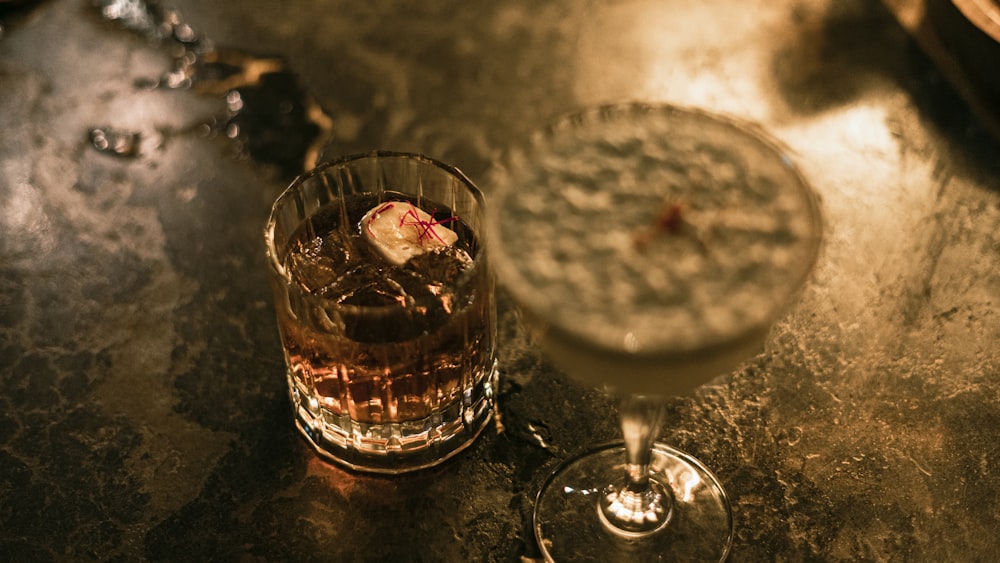 a close up of a drink in a glass on a table