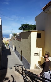 A concierge assisting a client with local arrangements in a sunny coastal town.