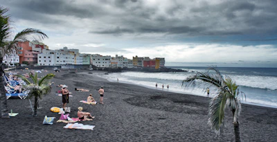 Golden sands of Labadi Beach with locals enjoying the sun.