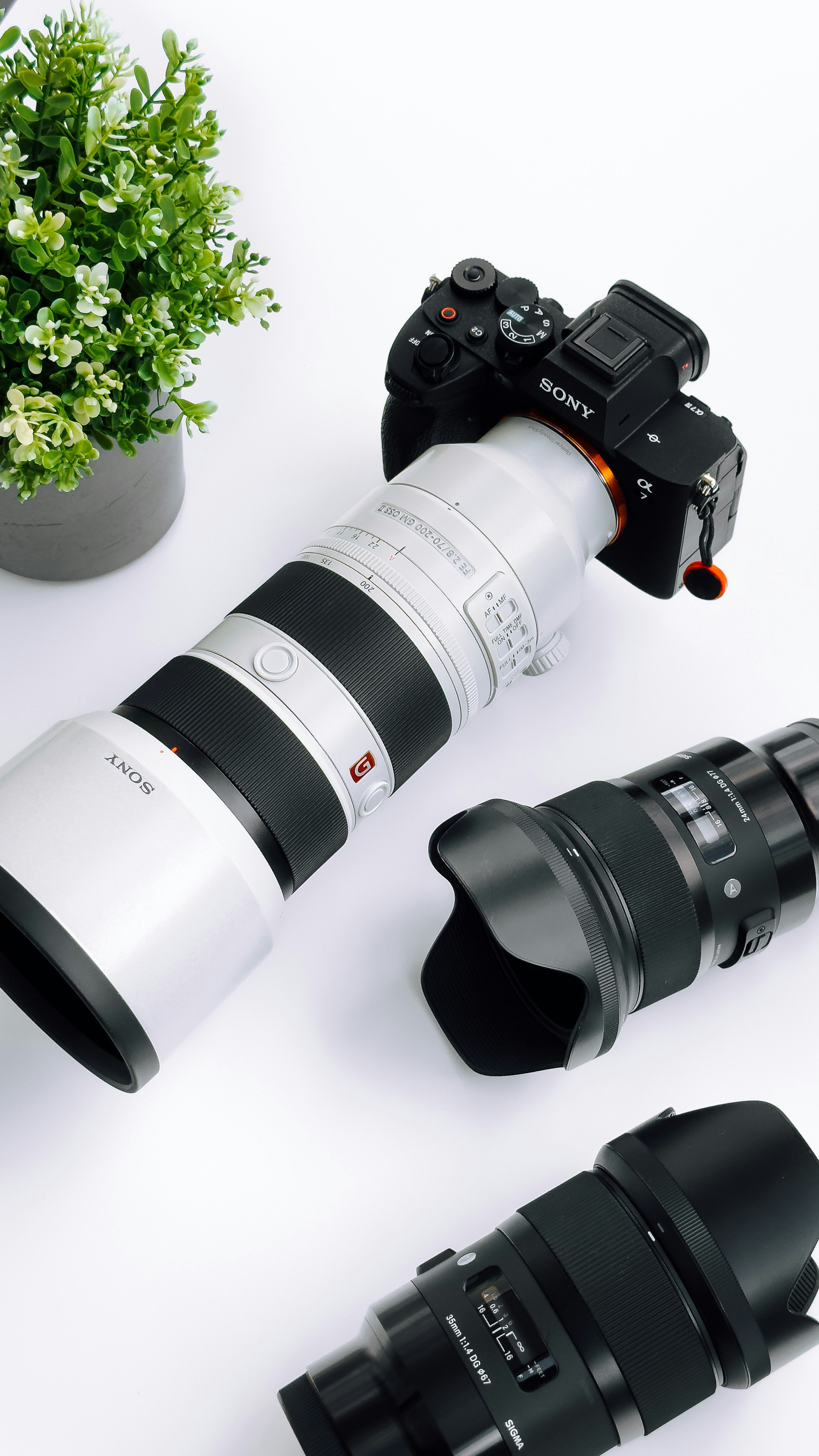 a camera and a lens on a table