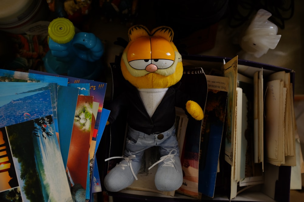 a stuffed animal sitting on top of a shelf