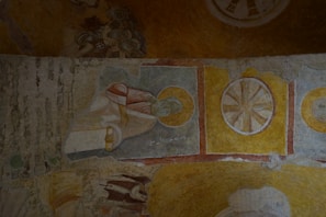 An old scroll depicting the evolution of Muay Boran to Muay Thai with illustrated fighters.