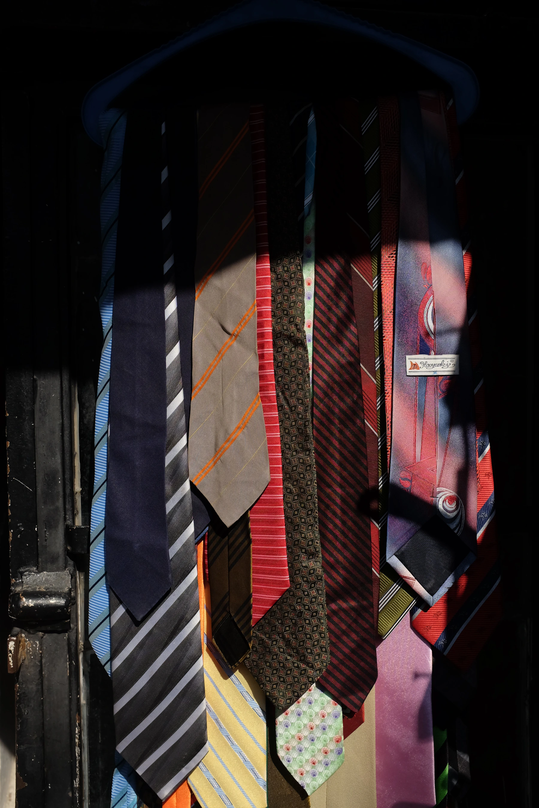 Rack of men's silk neckties representing the Jentlemens Permanent 10 bundle