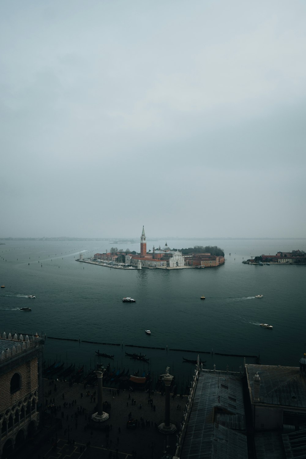 a large body of water with a city in the background