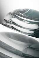 Soft gradients merging into dynamic abstract forms on textured surface.