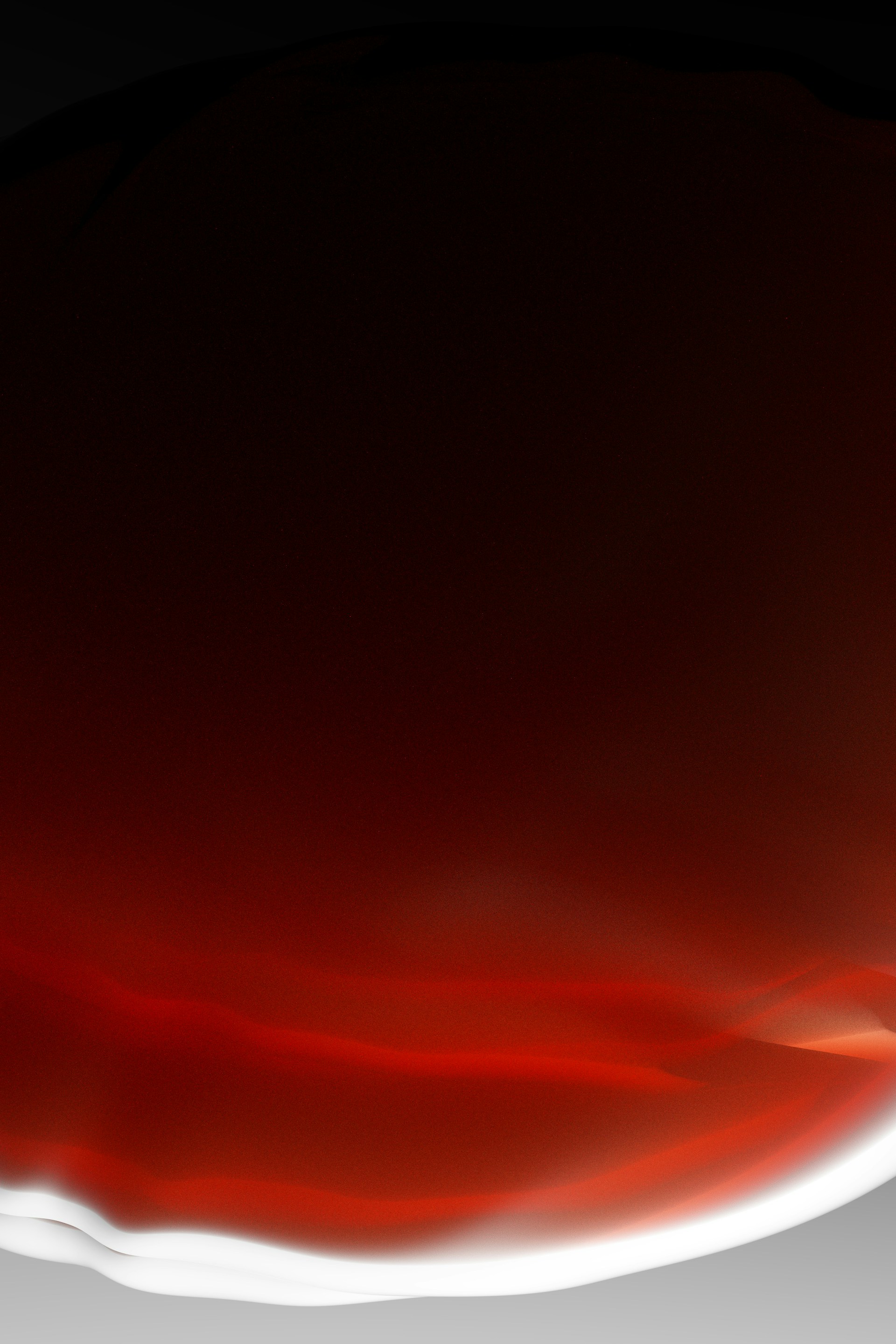 a close up of a red and white plate