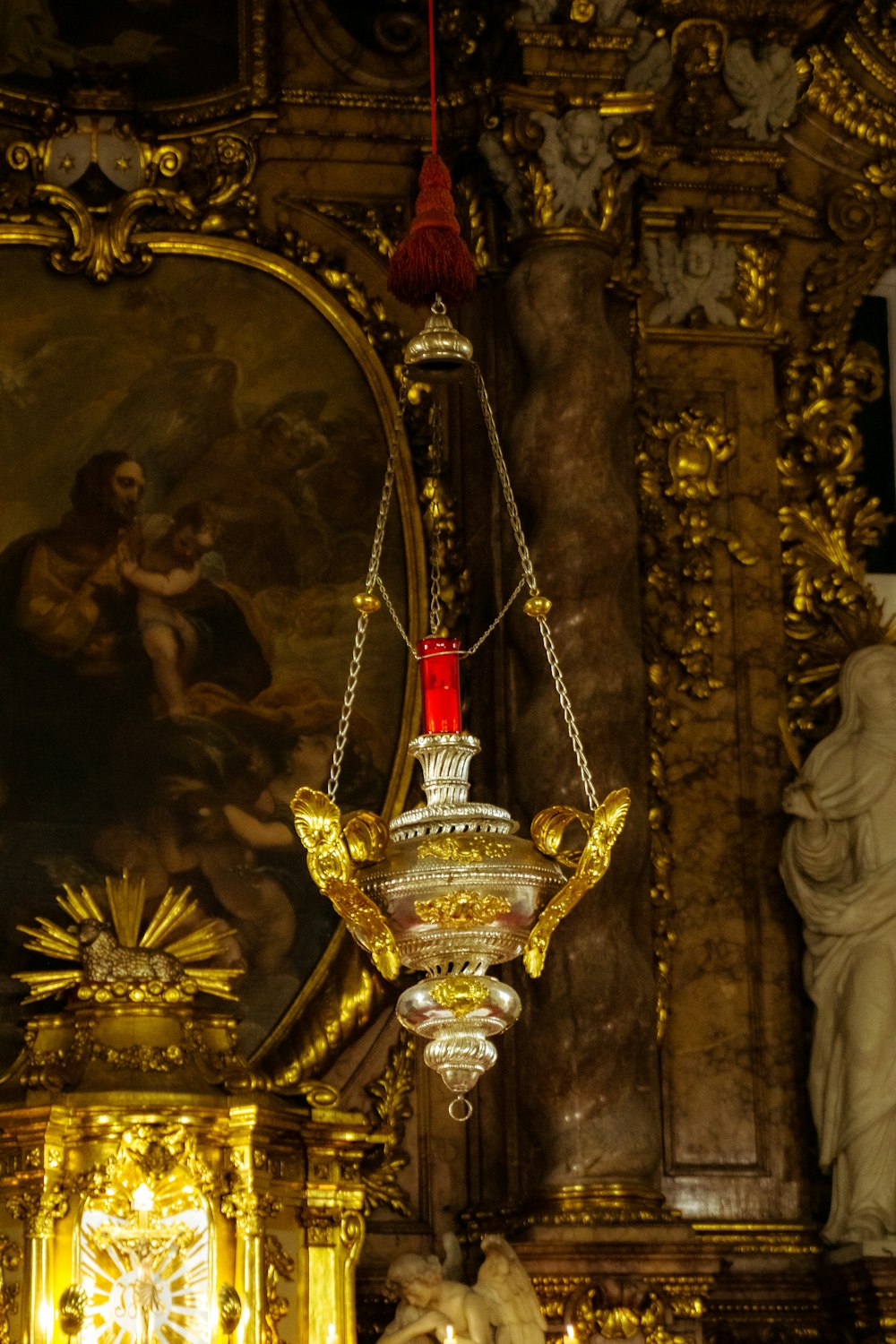 a chandelier hanging from the ceiling of a church