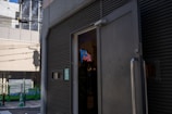 Currency com us office exterior with signage visible during a sunny day.