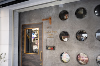 The exterior of Domus Faber Fab Lab with colorful signage in yellow, blue, and orange