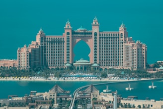 a view of a very large building in the middle of the ocean
