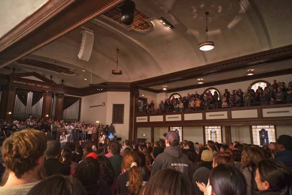 a large crowd of people in a building