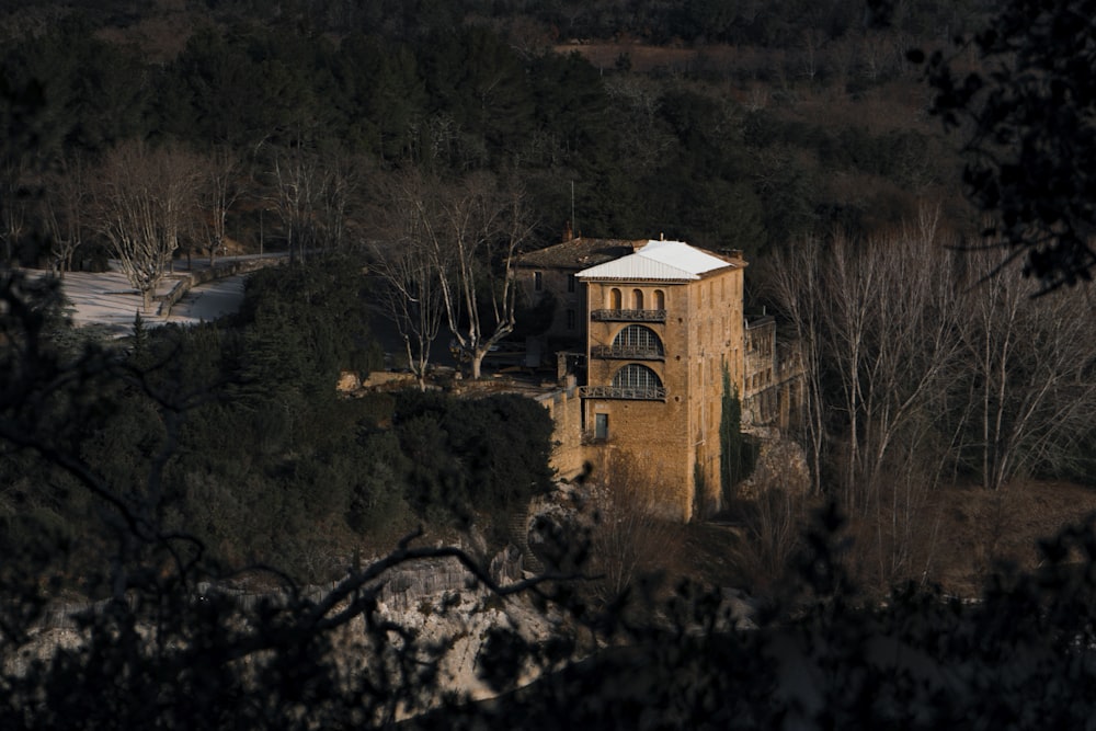 an old building in the middle of a forest