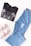 A folded black t-shirt with a rhinestone bear design is placed next to a pair of light blue distressed jeans. Below them, a pair of white sneakers with pink accents are visible. The items are arranged on a white surface, creating a casual outfit layout.