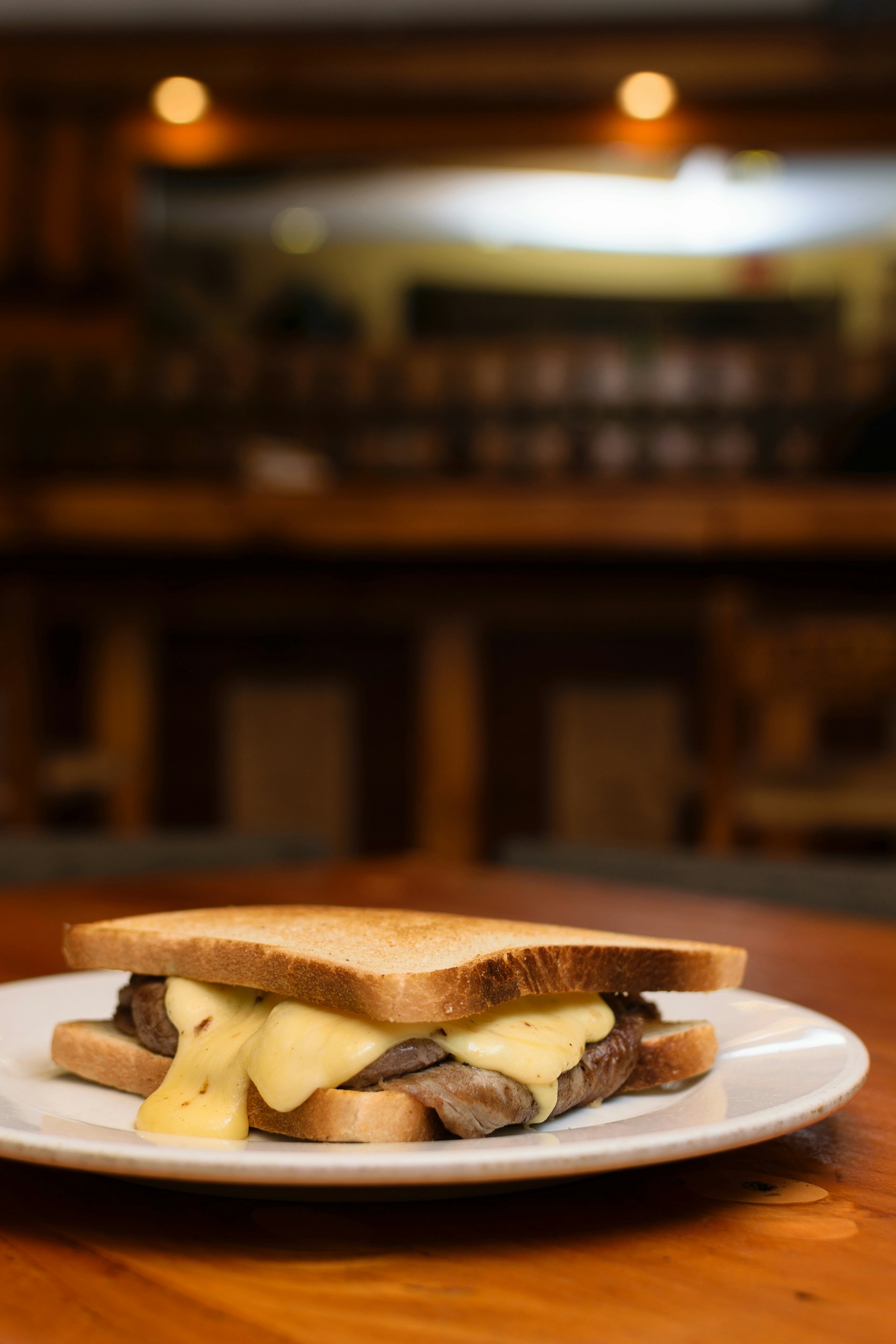 a grilled cheese sandwich on a plate on a table