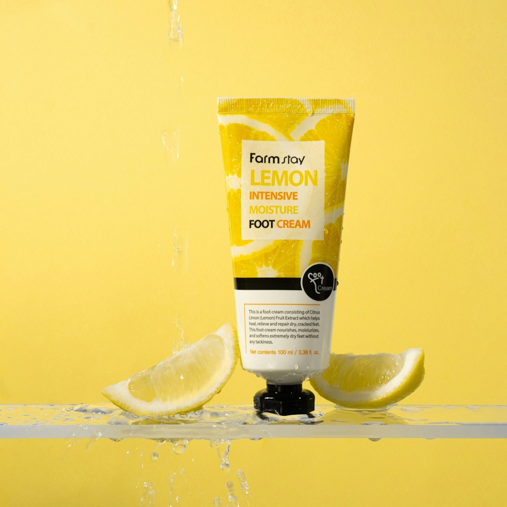 a tube of lemon intensive foot cream on a yellow background