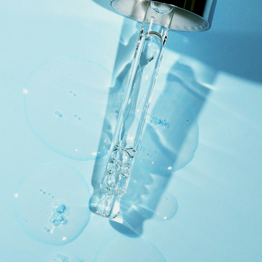 a close up of a water faucet with bubbles