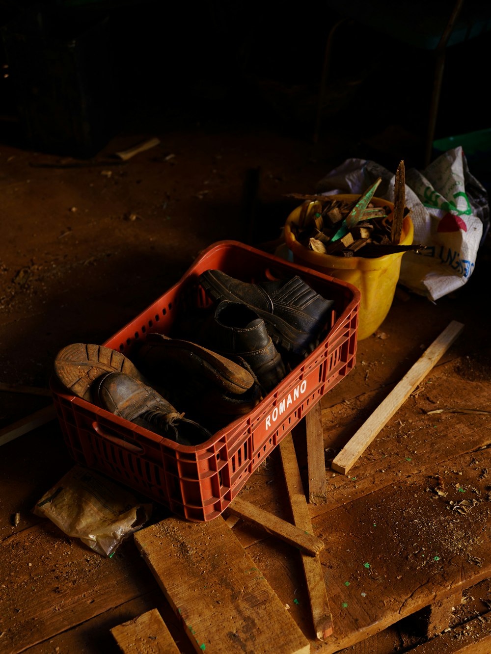 a crate of shoes sitting on top of a wooden floor
