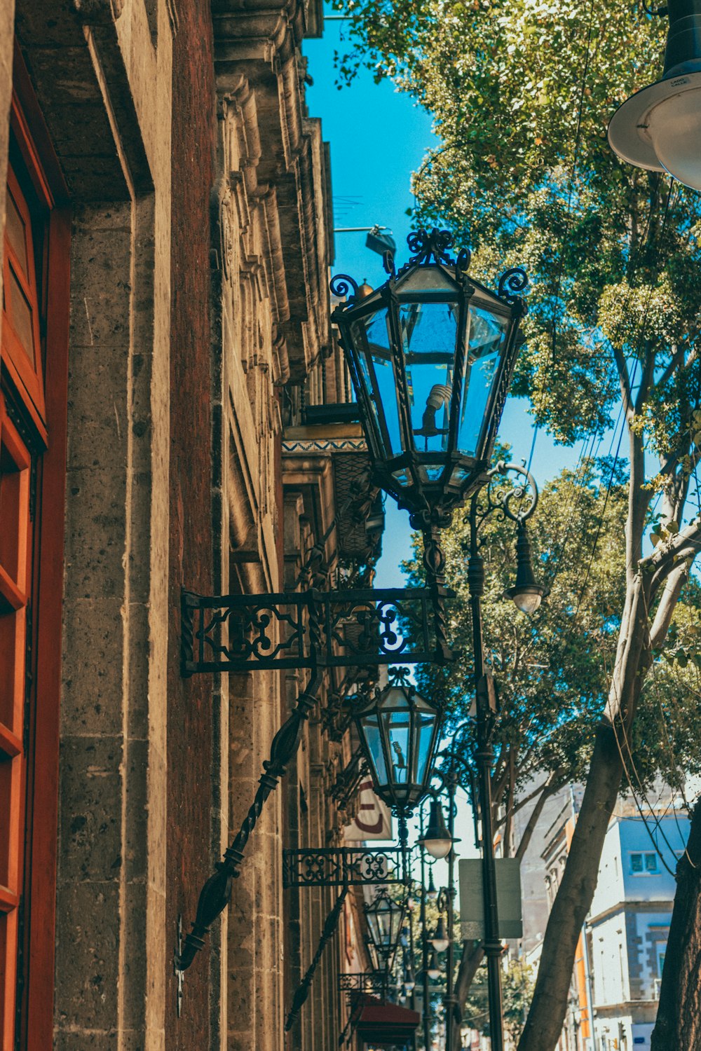 a street light hanging from the side of a building