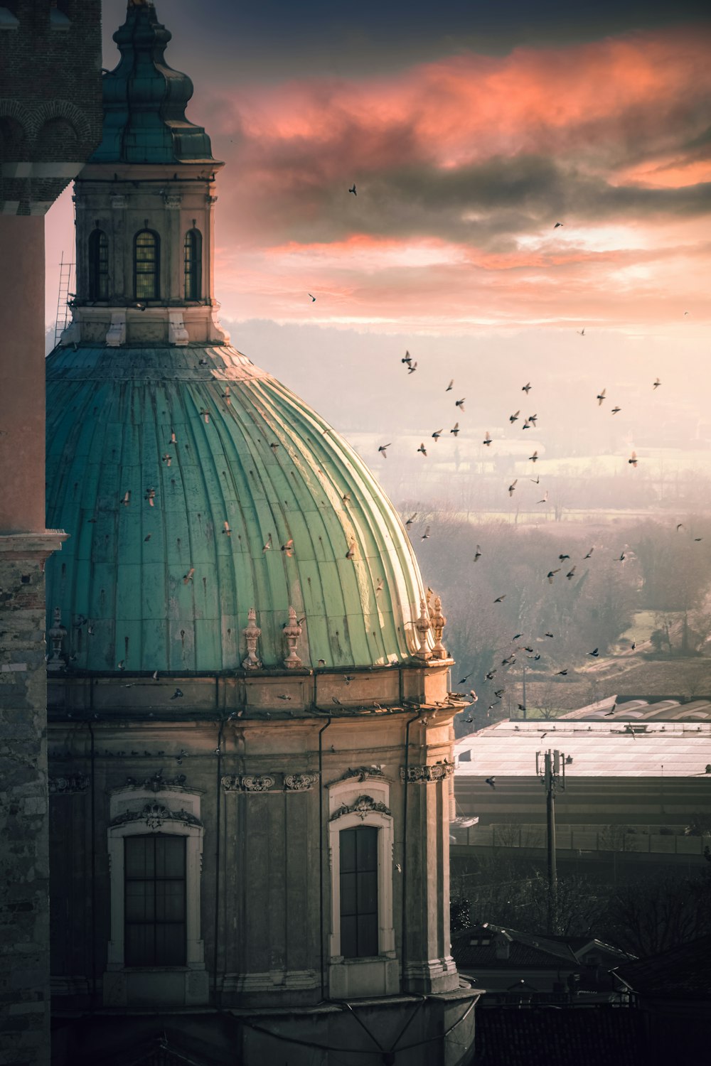 a large building with a green dome on top of it