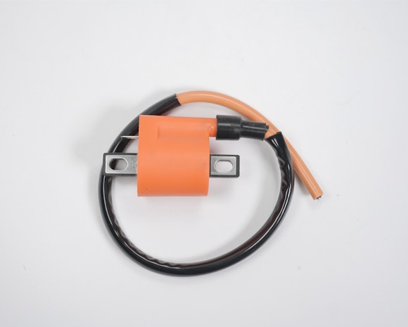 An assortment of ignition coils and related parts from Balaji Automobile.