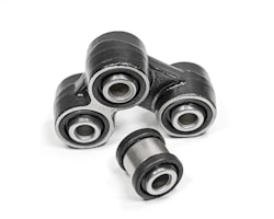 A close-up of metal mechanical components consisting of multiple rubber bushings. The bushings are primarily black with a metallic silver inner ring and are set against a plain white background.
