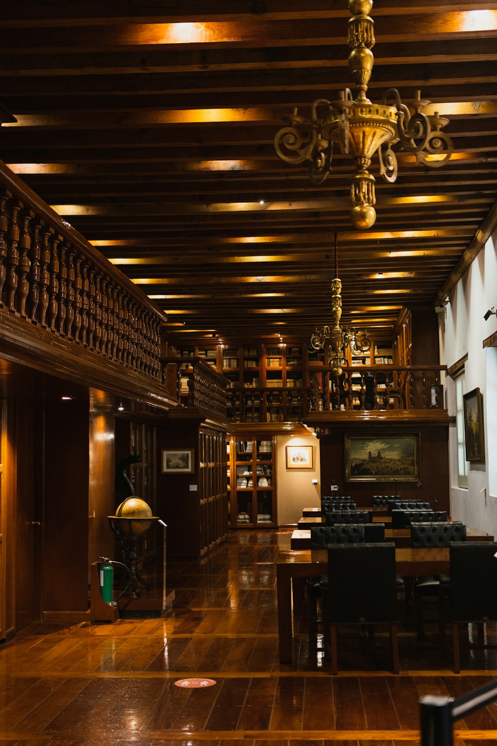 a large room with a chandelier and tables