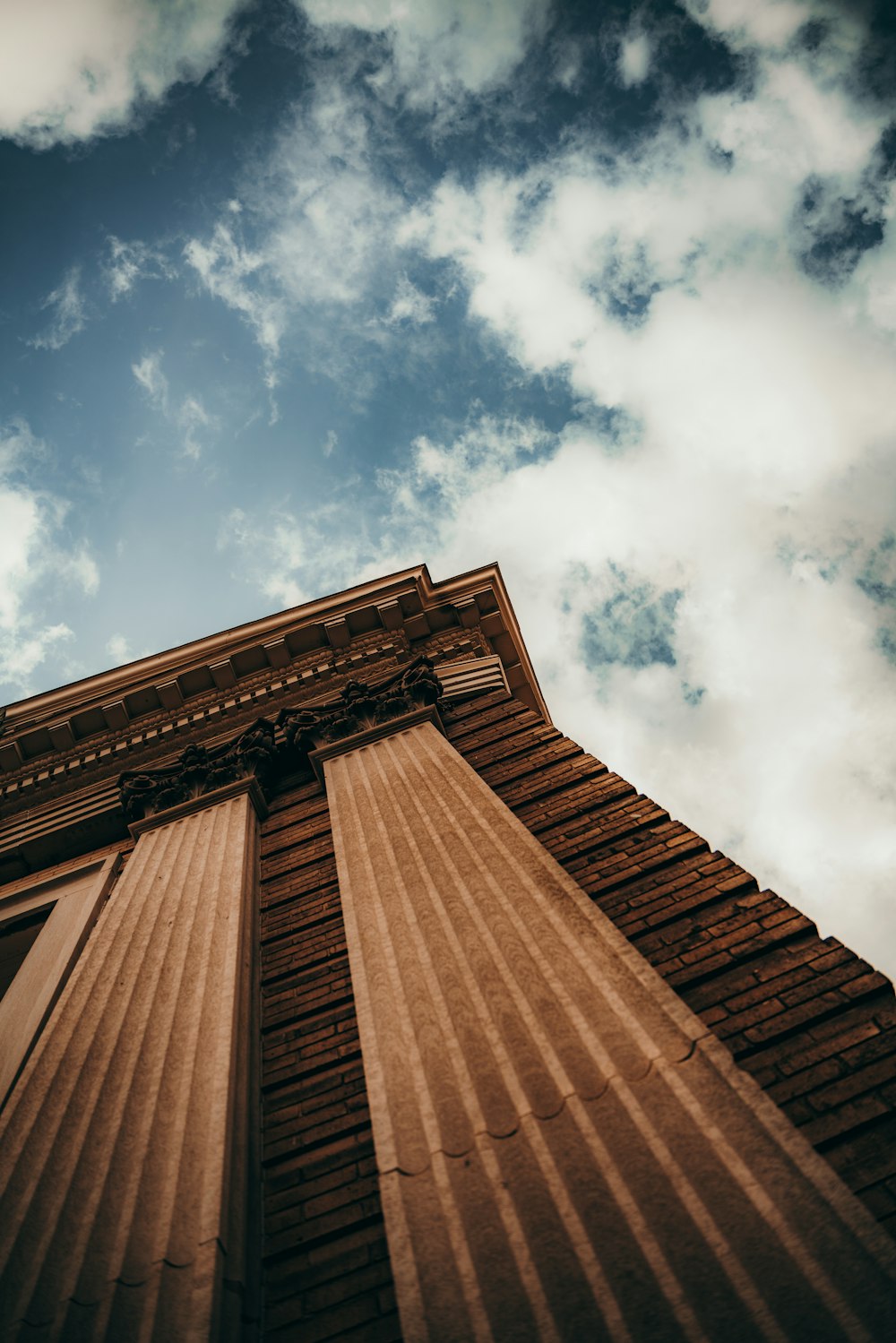 a tall brick building with a sky in the background