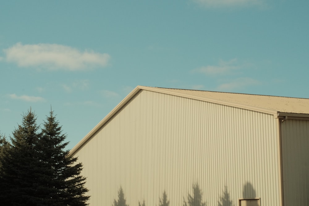 a large building with trees in front of it