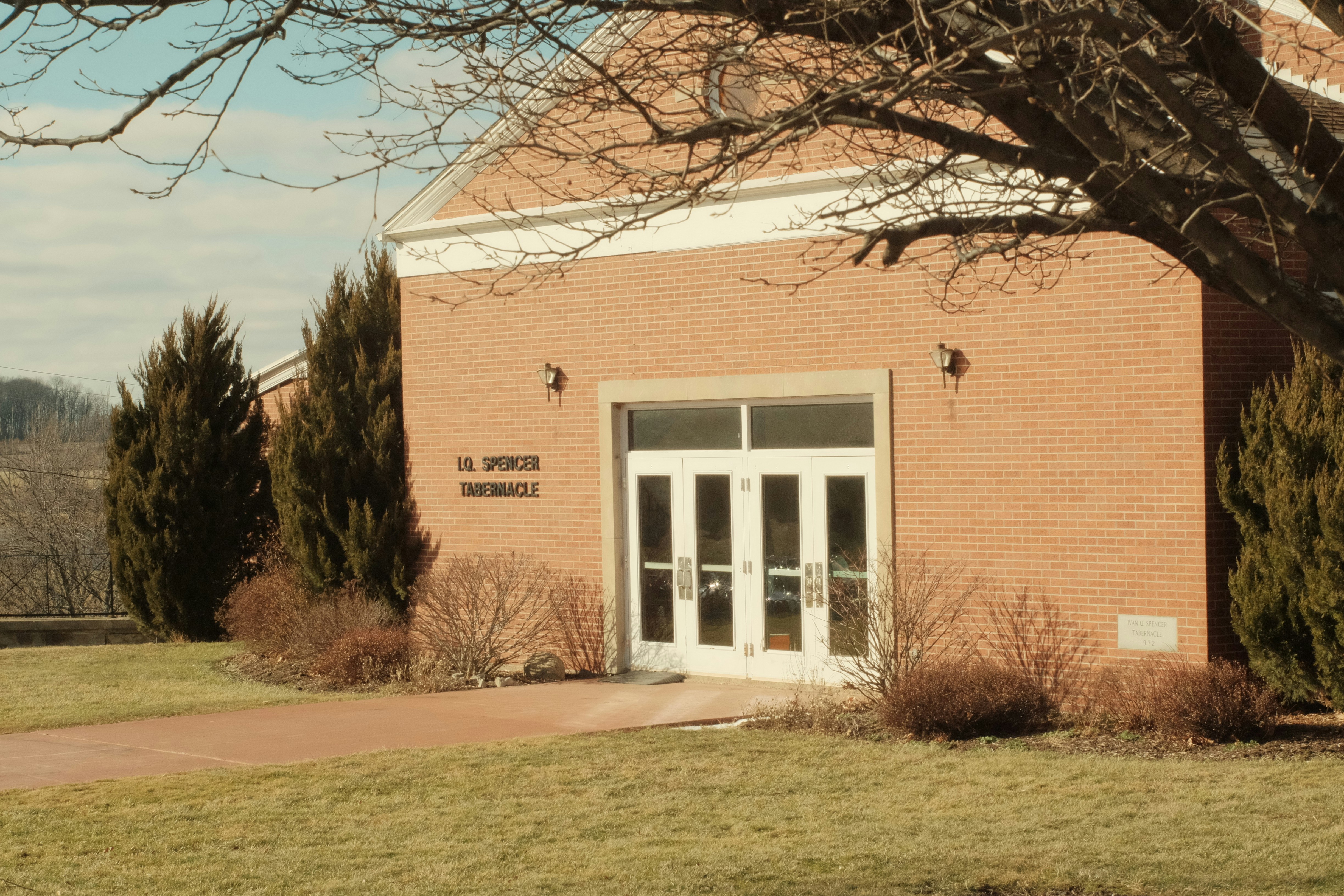 a brick building with a clock on the front of it