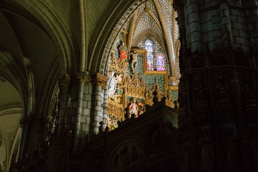 a cathedral with a statue of jesus on the alter