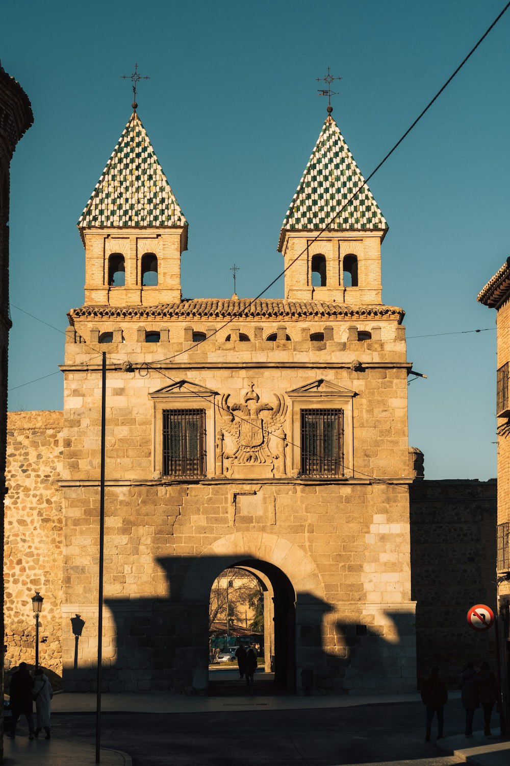 a large building with two towers and a clock on it