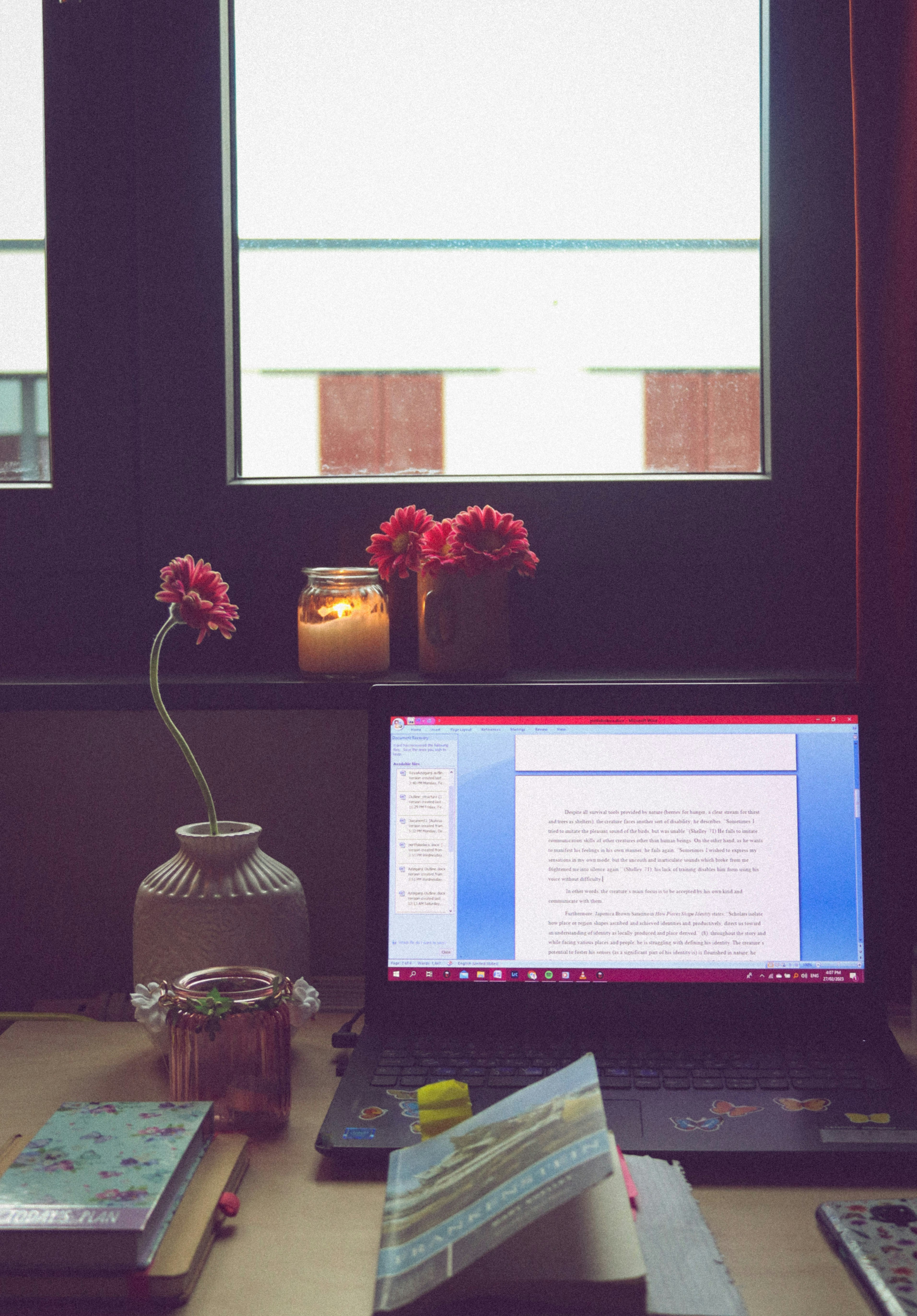a laptop computer sitting on top of a desk
