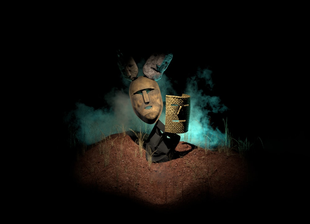 a creepy mask sitting on top of a pile of dirt