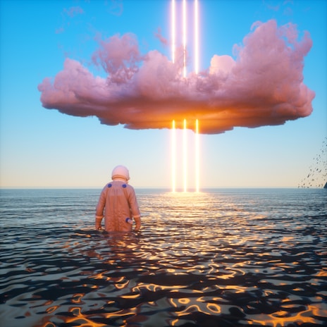 An astronaut stands waist-deep in a calm body of water, gazing at a large, dark cloud hovering in the sky. Bright vertical beams of light and orange hues illuminate the clouds and reflect on the water's surface. Birds are visible in the distance to the right.