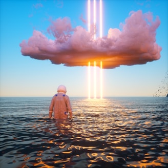 An astronaut stands waist-deep in a calm body of water, gazing at a large, dark cloud hovering in the sky. Bright vertical beams of light and orange hues illuminate the clouds and reflect on the water's surface. Birds are visible in the distance to the right.